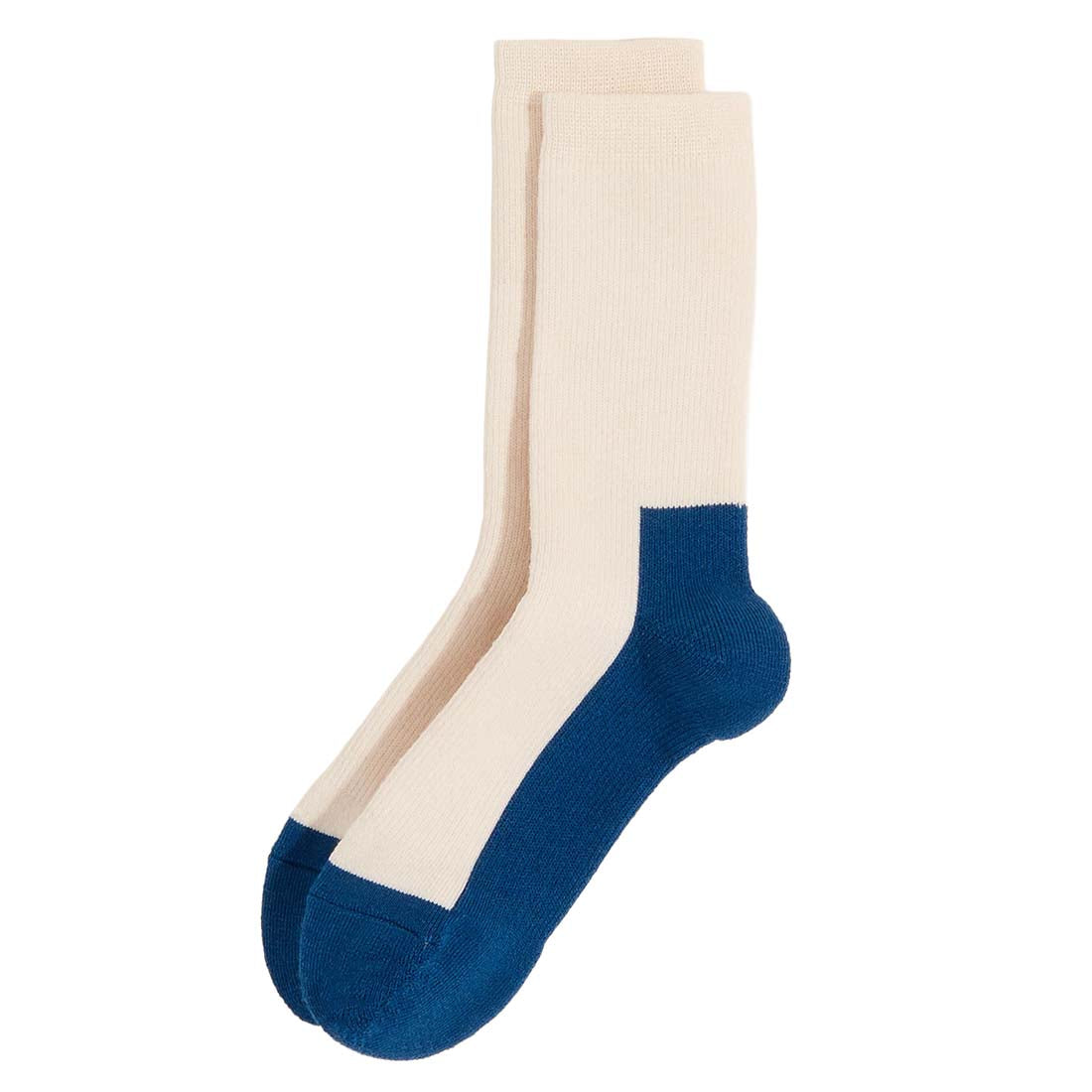 Pair of socks with beige top and blue bottom on a white background