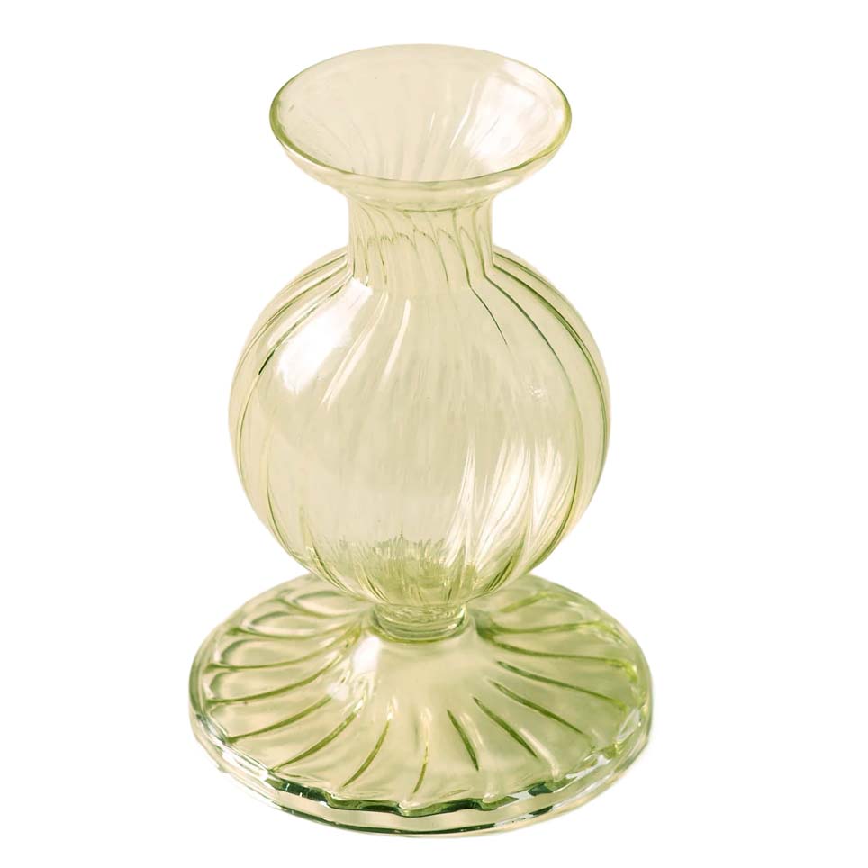 Green glass vase with textured design on a white background