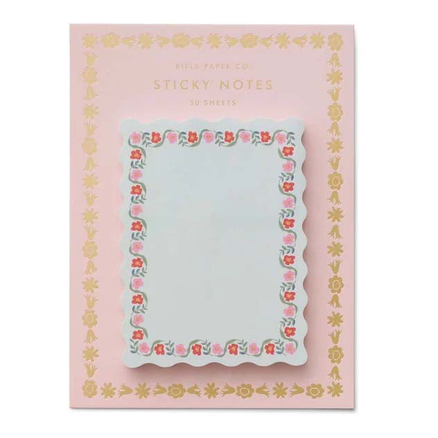 Sticky notes with floral design on a pink background