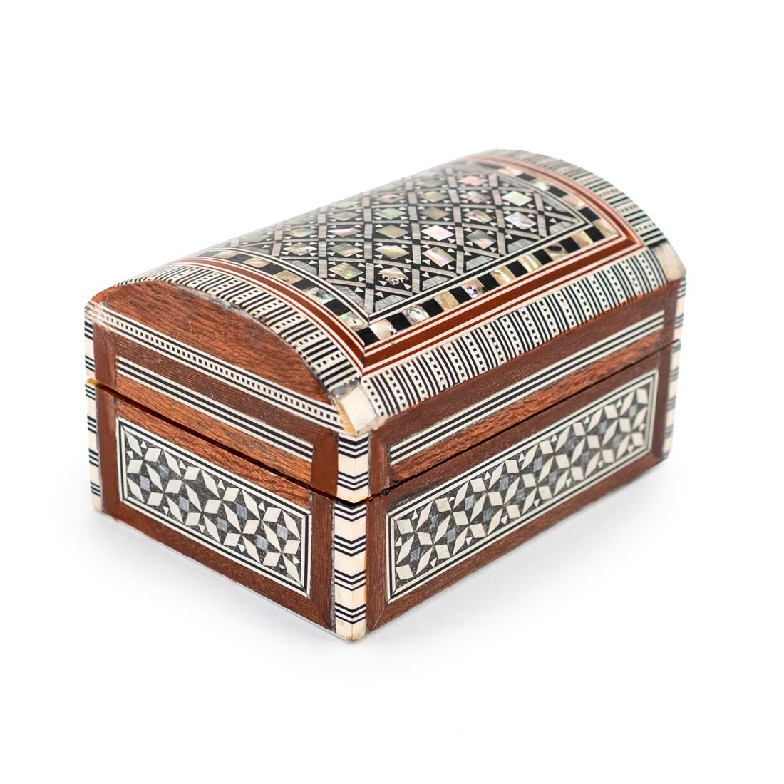 A small rectangular wooden box with geometric mother of pearl inlay on the lid.